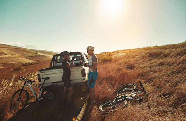 Shot of a pair of adventurous mountain bikers getting ready to explore a new trail together