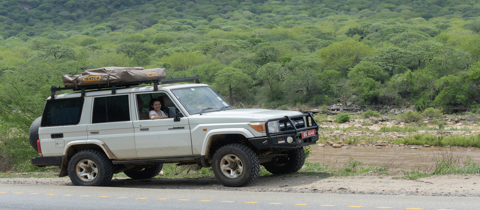A tourist on a self drive to Masai Mara with a 4x4 landcruiser from Uganda to Kenya